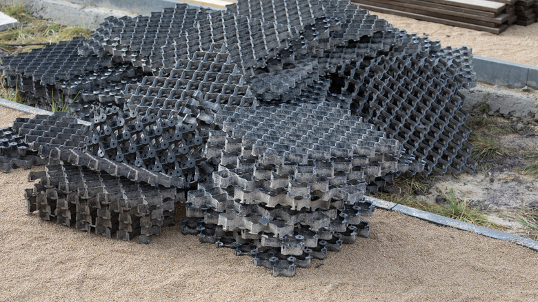 Stacked gravel grid squares before installation