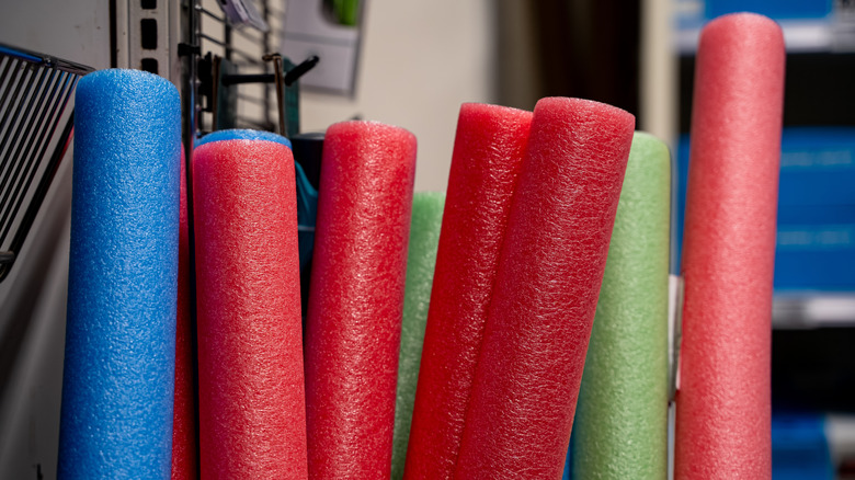 close up of colorful pool noodles