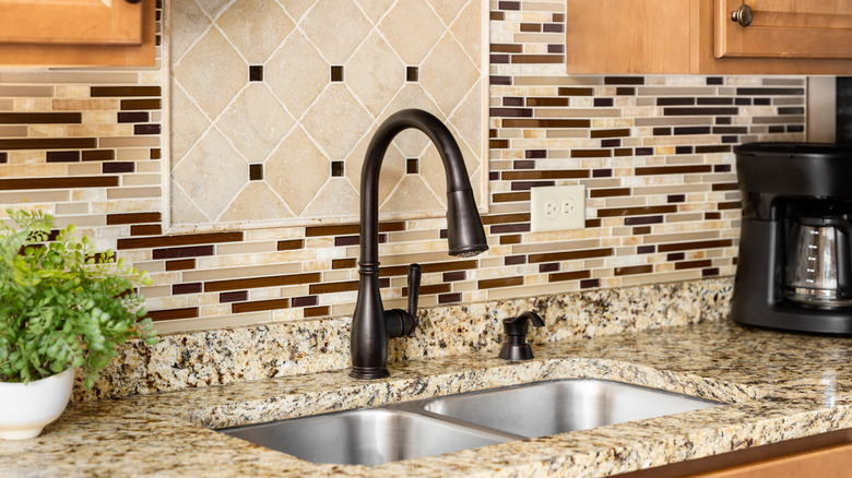 An oil-rubbed bronze faucet in a kitchen