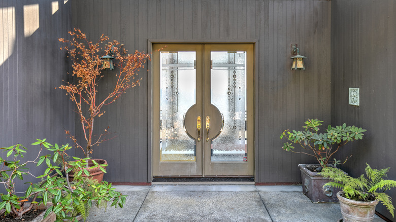 A front door with textured glass