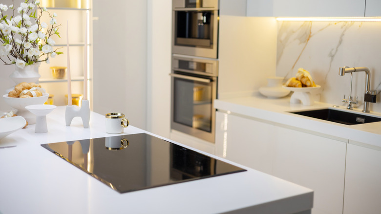 modern kitchen with cooktop on the island