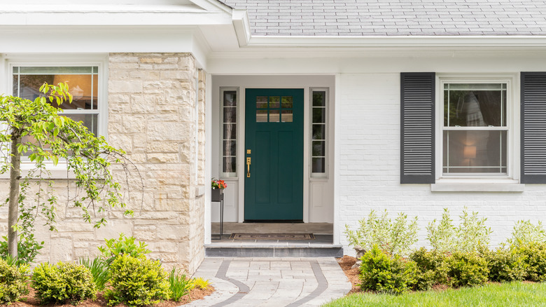 White home with a dark green front door