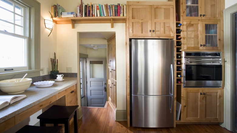 cluttered kitchen with built-in appliances
