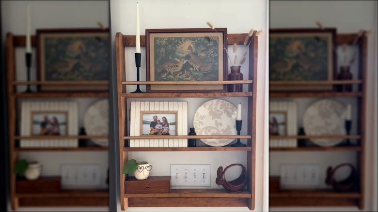 Wooden shelving hung around a light switch