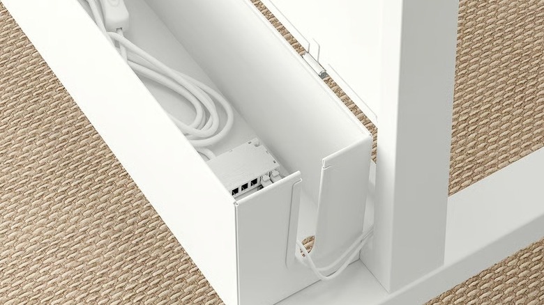 MONTERA Cable Management system holding cable on white skirting board