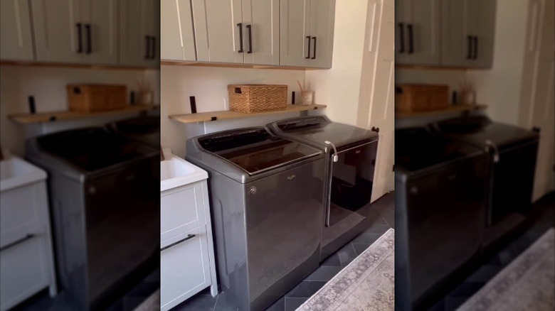 An outlet-box-hiding laundry storage shelf