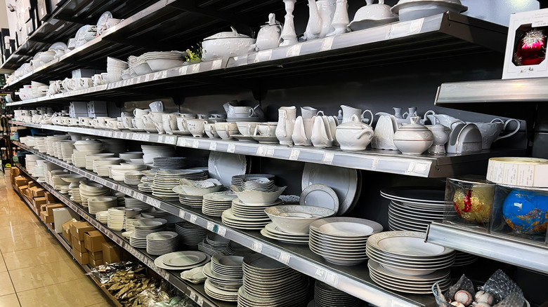 A store shelf with assorted dinnerware