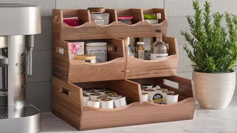 Stackable wood bins sit on top of each other filled with pantry essentials