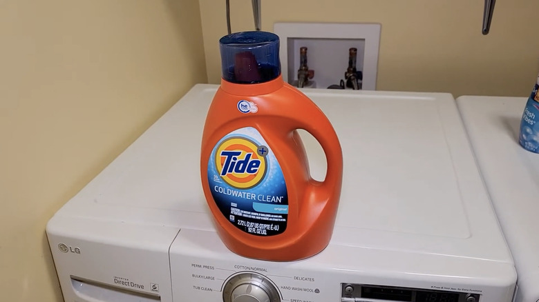 bottle of Tide Coldwater Clean on washer