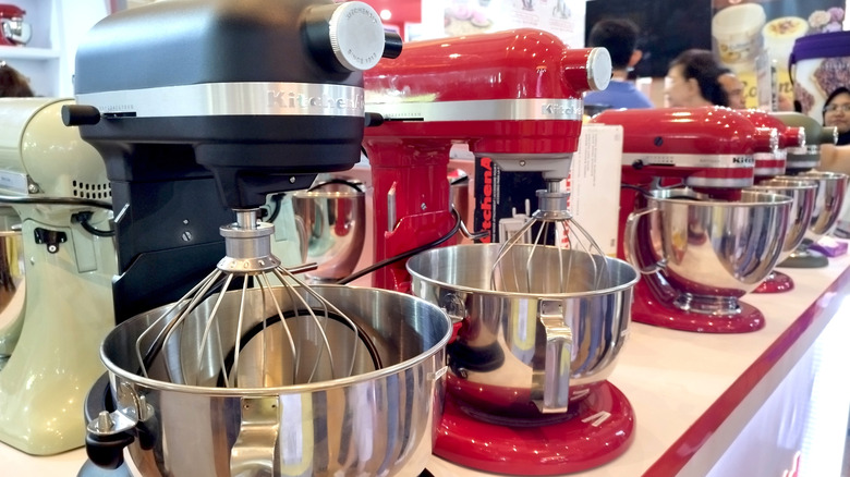 Various KitchenAid mixers displayed at a store