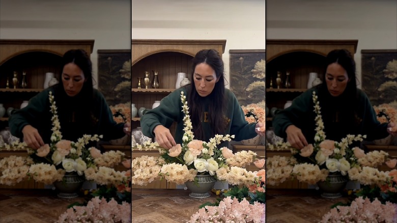 Joanna Gaines arranging artificial flowers