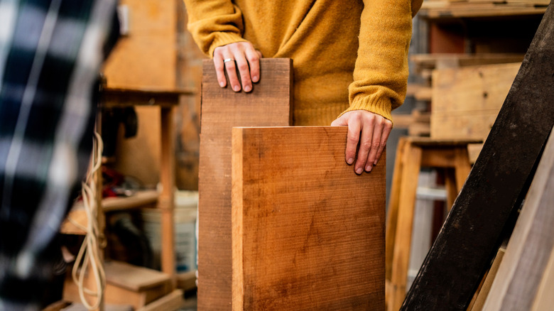 Person choosing wood for a project