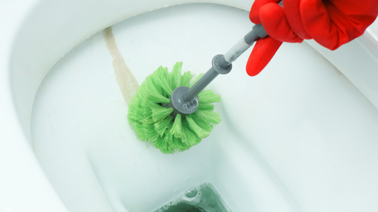 Cleaning limescale deposits from toilet bowl