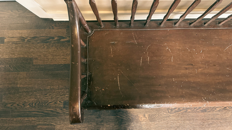 scratched wooden bench