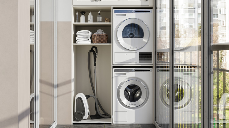 Stackable washer and dryer on the right side of a room