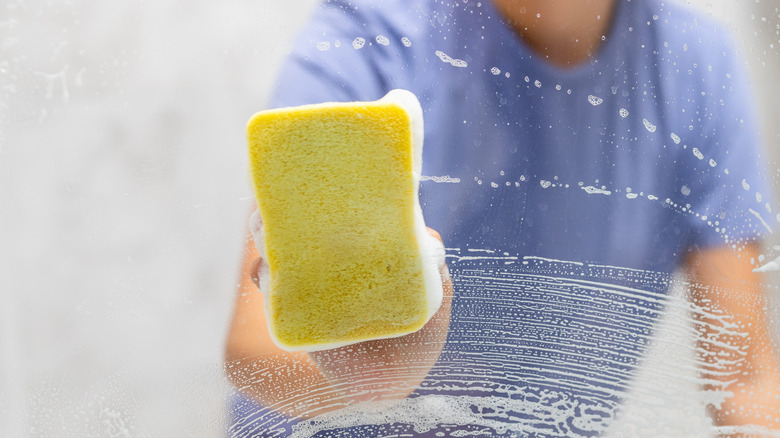 Cleaning hard water stains from a glass shower door