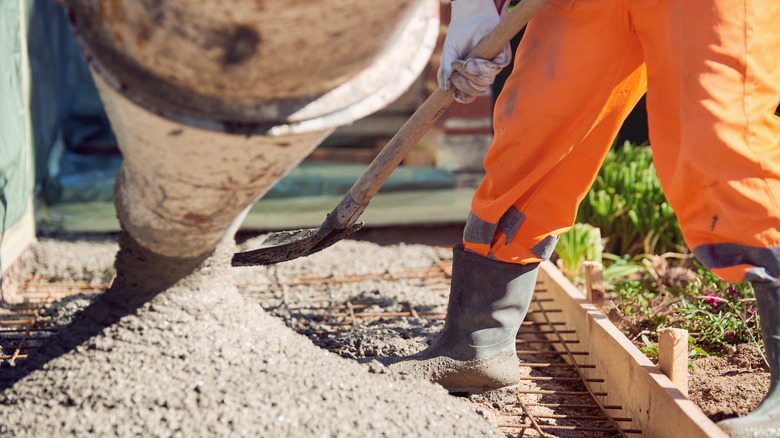 Worker pouring ready-mix concrete