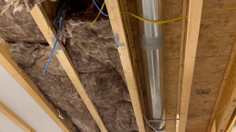 The Collins family's basement ceiling with drywall panels, with insulation, and with neither