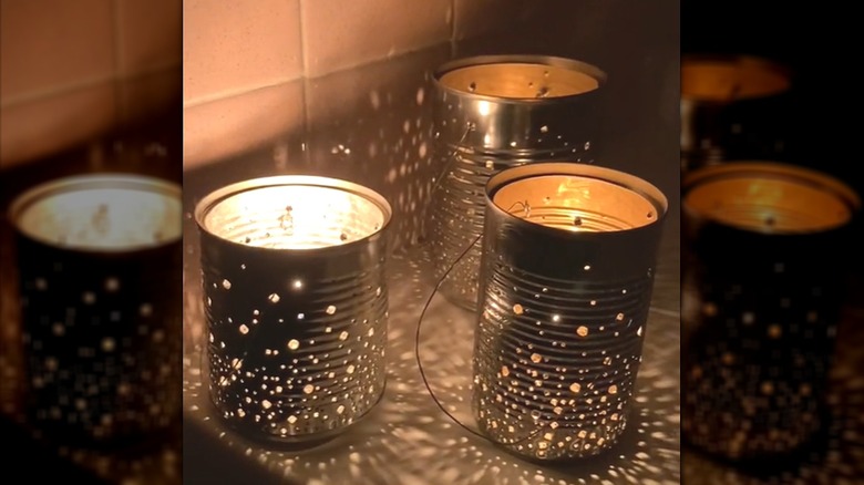 Soup cans repurposed into star-like metal luminaries