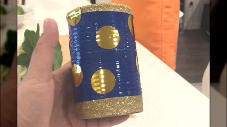 Blue and gold decorated soup can designed for bathroom countertop storage