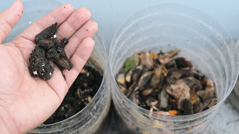 recycled plastic containers being used as compost bins