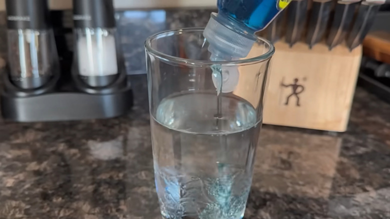 Glass of water with blue Dawn