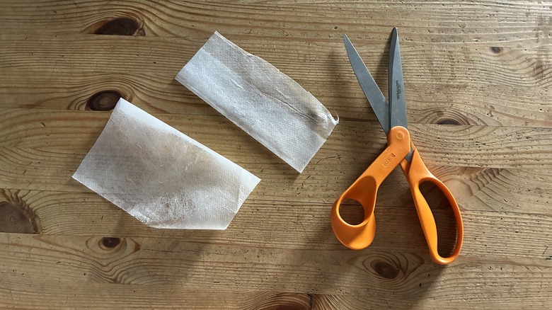 Scissors and dryer sheets on wooden table