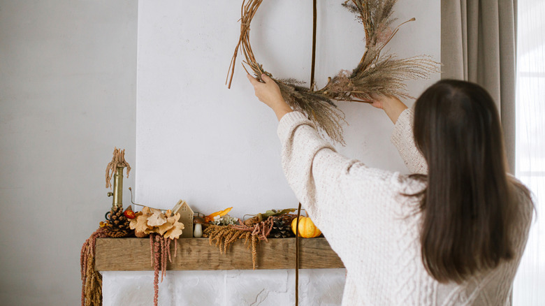 Woman decorating for fall