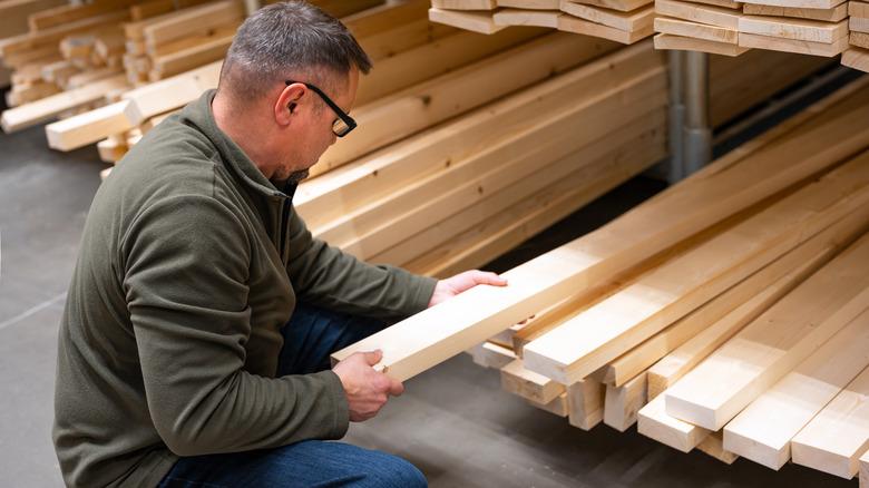 Person buying wood plank