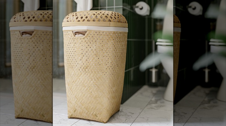 IKEA laundry hamper in front of toilet