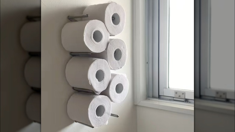 VARIERA Pot lid organizer mounted on wall holding toilet paper rolls