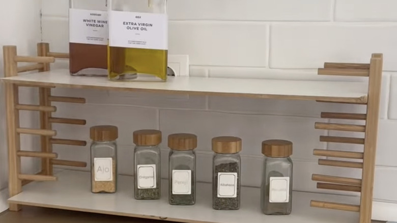 Shelf made from IKEA OSTBIT plate racks on a kitchen countertop