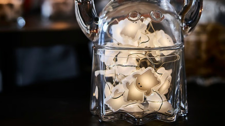 A string of LED ghost lights inside a glass bowl with lid