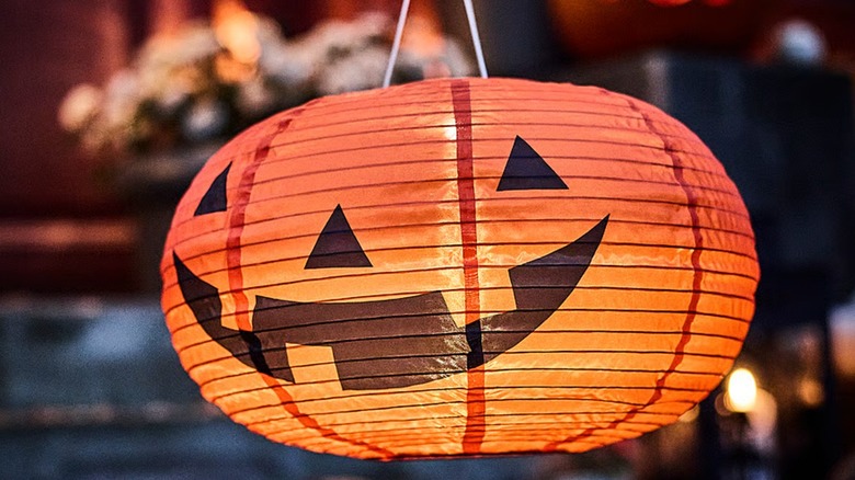 An orange pumpkin pendant lamp