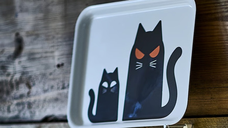 Two spooky cats imprinted on a white tray