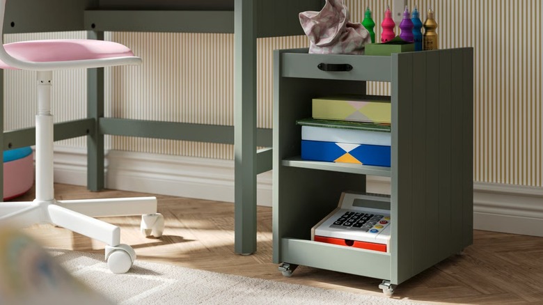BRYTNING Storage Unit next to desk with office items stored