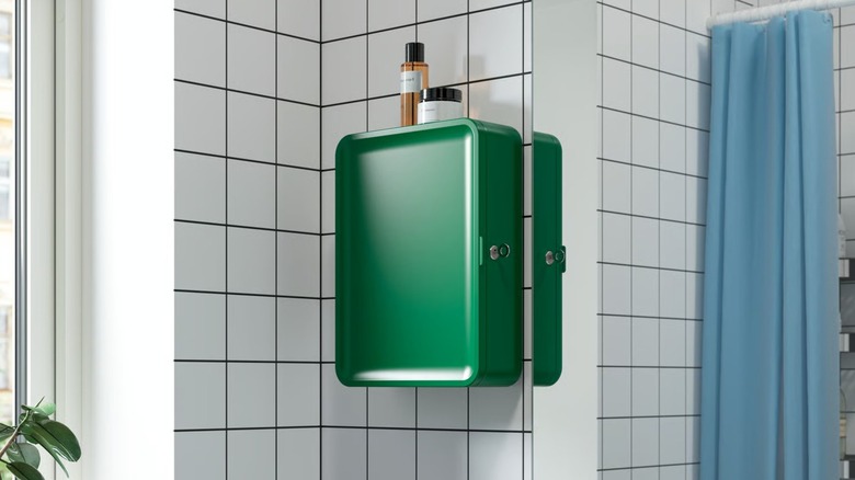 Green HUSBYÅN Wall Cabinet mounted in tile bathroom wall