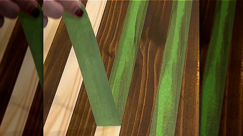 Unfinished pine pieces of the IKEA RAGGBERG show bench taped off