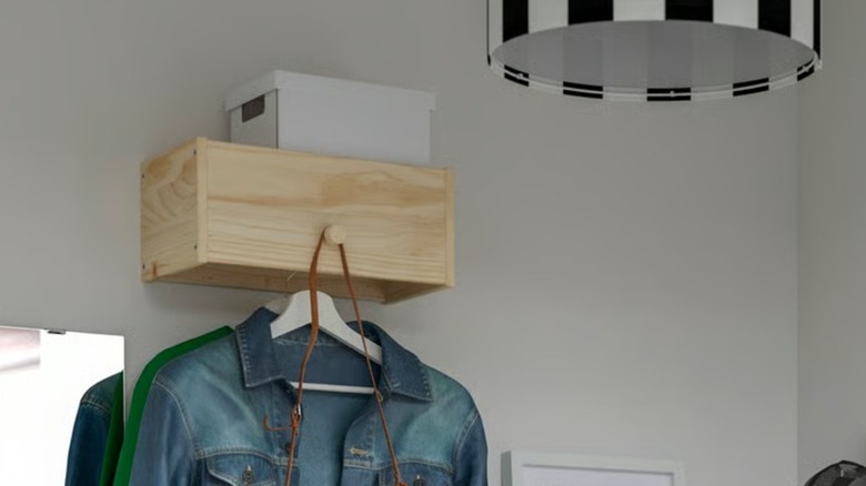 Wall-mounted RAGGBERG Coat Rack with coats hanging from it