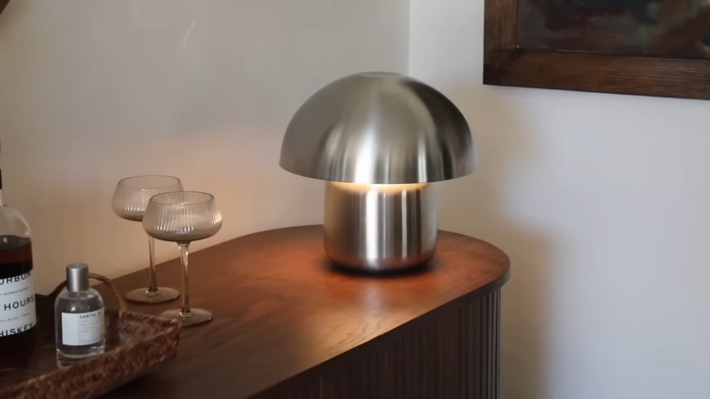 DIY lamp made from a coffee pot for the base, a lamp kit, and a serving bowl for the shade