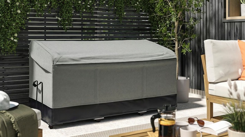 VÄTTERSÖ Storage Box on modern outdoor patio next to seating area
