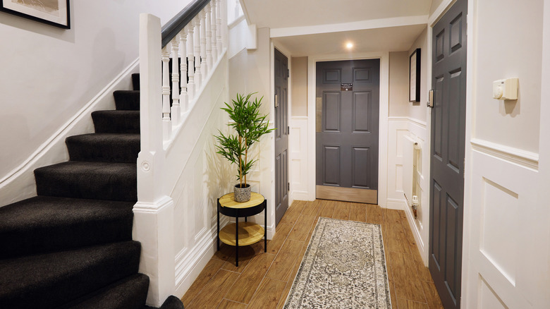A suburban home's hallway with outdated six-panel interior doors