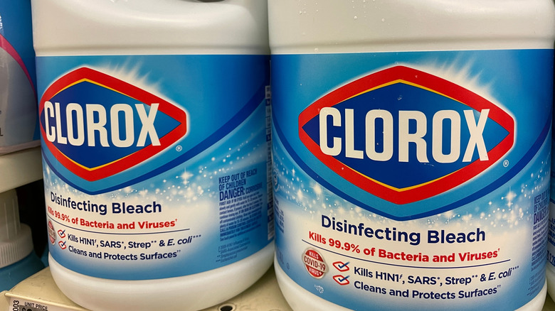 Two bottles of Clorox bleach sitting side by side.