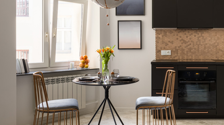 a small bistro table in a modern kitchen