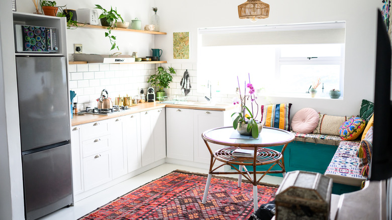 a modern kitchen with an eat-in area