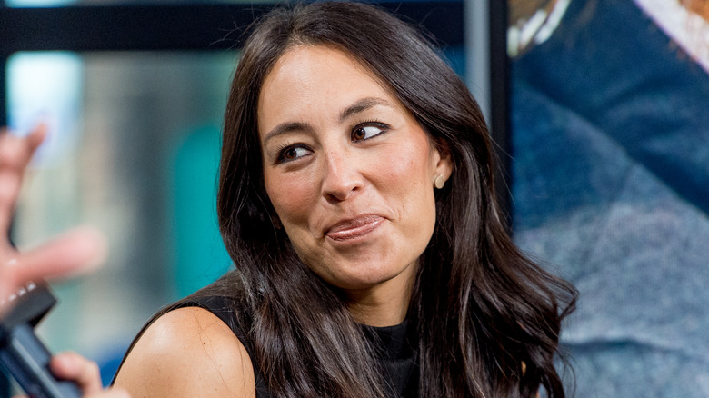 Joanna Gaines smiling during a panel discussion