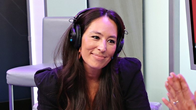 Joanna Gaines sitting for an interview with headphones on