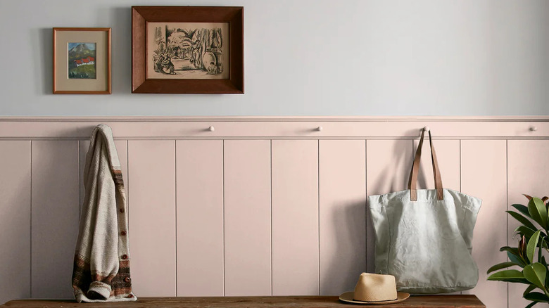 a dining room walls painted in Magnolia Home's Ella Rose pink paint