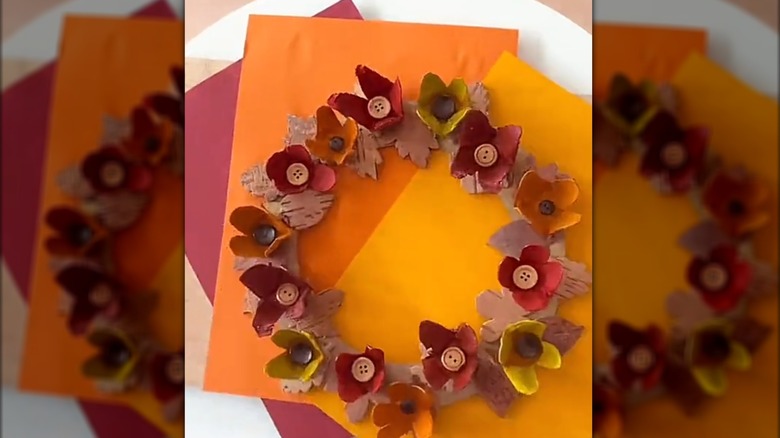 Fall wreath made from cardboard and egg cartons made into flowers