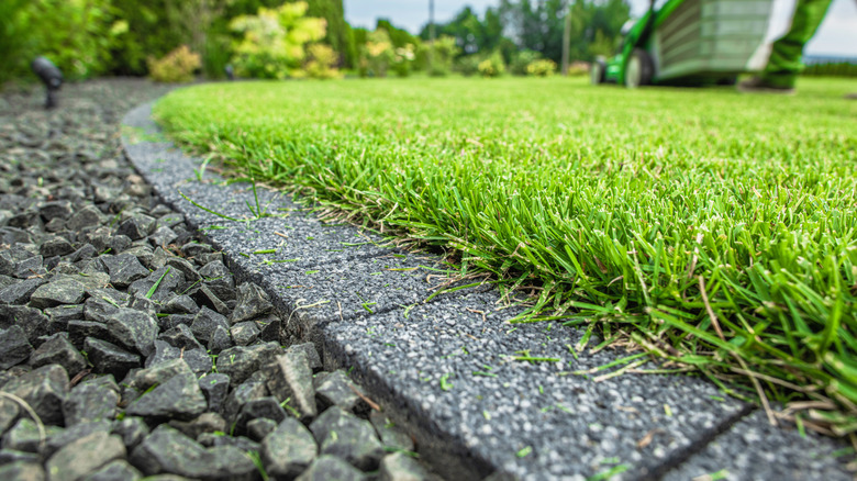 Granite edging against lawn and gravel